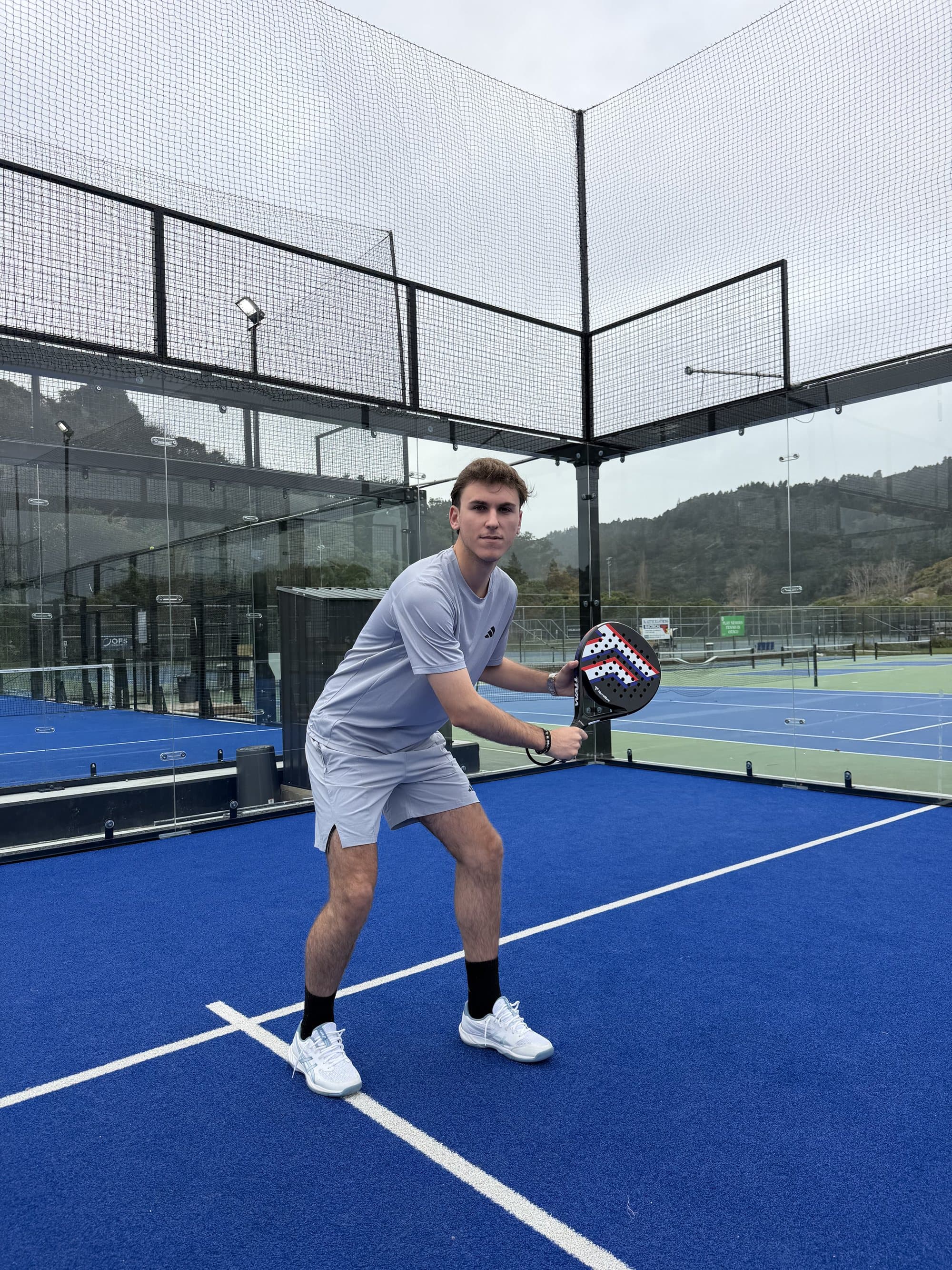 Padel player preparing for a return